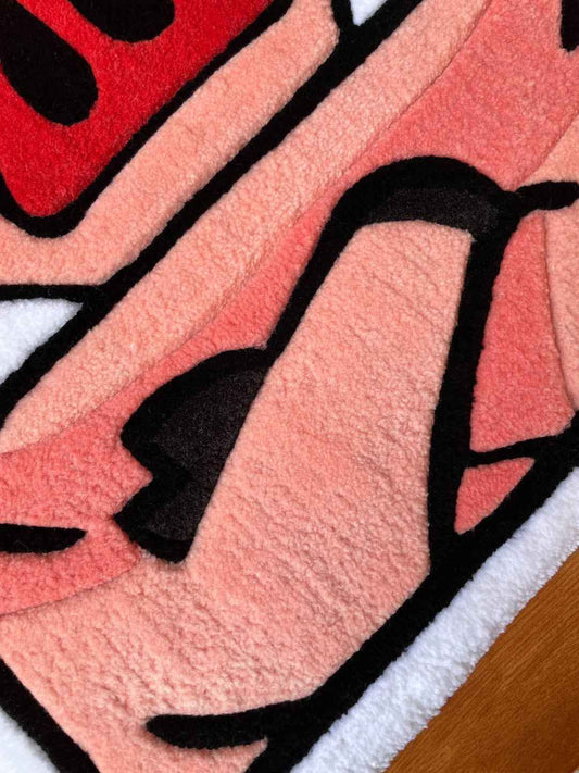 Royal Hog Rug close-up of plush pink body with black outlines and white trim