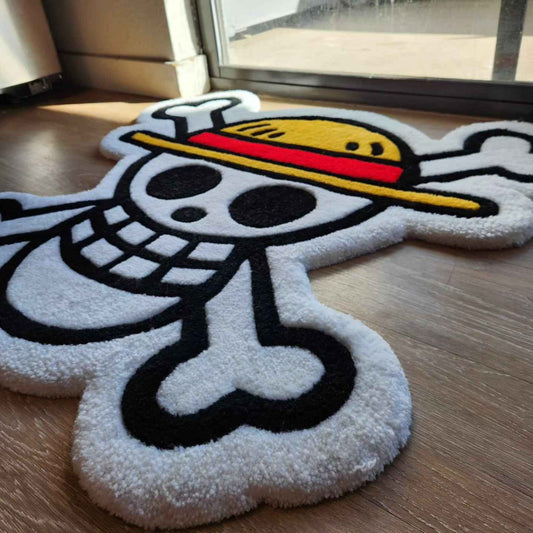 Pirate skull rug with straw-hat motif, angled view, plush loop pile on floor