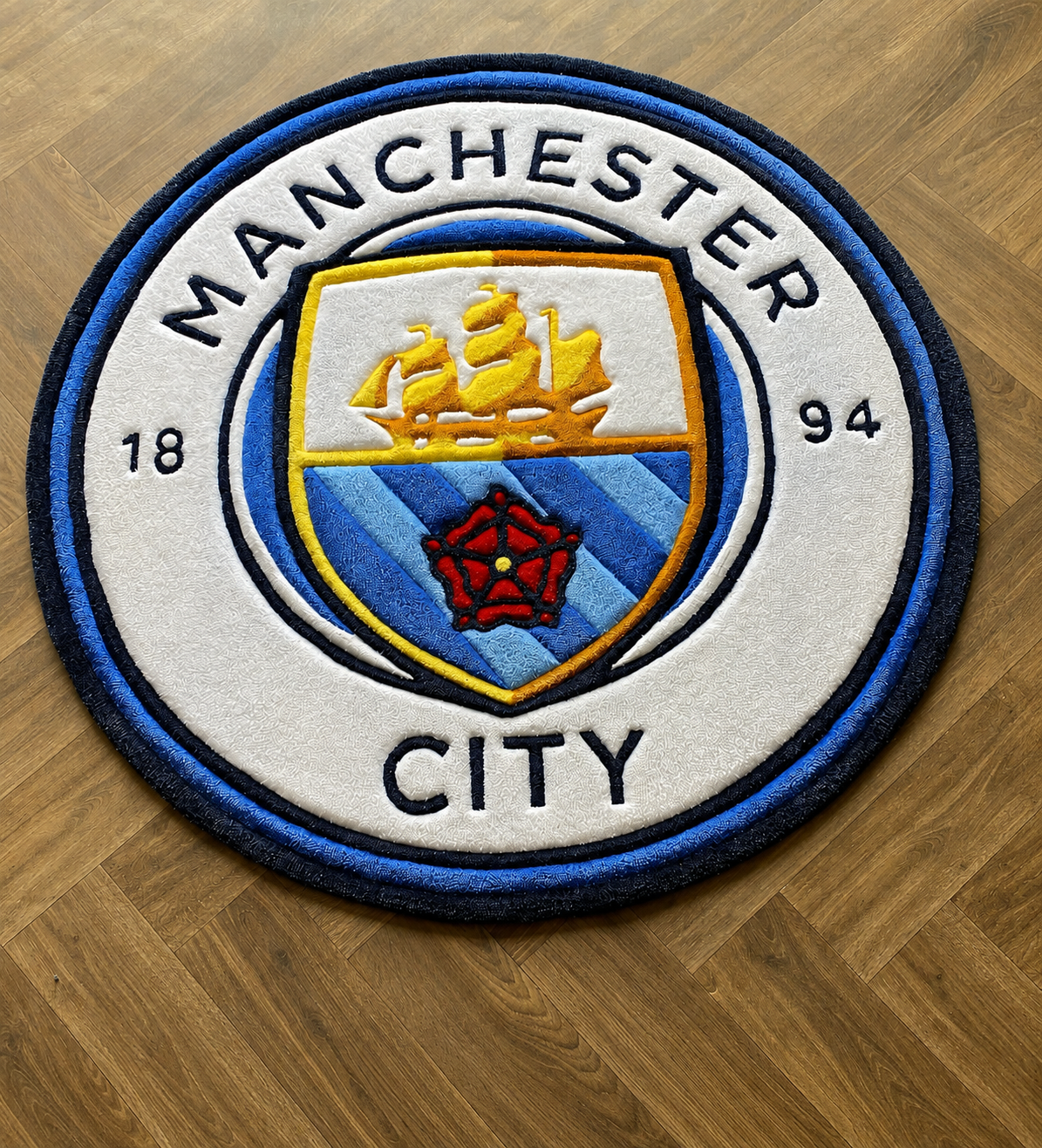 Manchester City football rug handmade in blue, white and gold