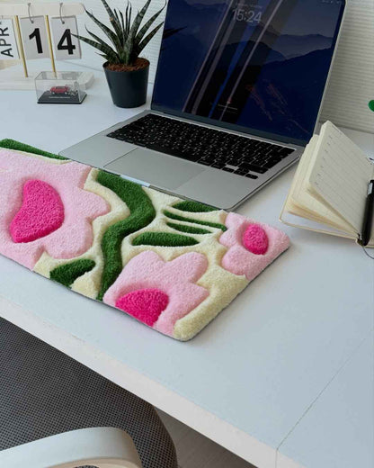 Rectangular tufted desk mat with pink and green floral design