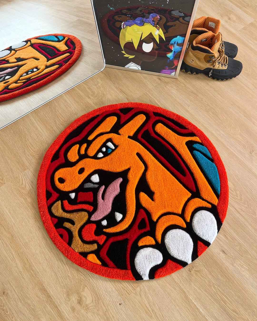 Round handmade Charizard area rug, orange dragon head with white paw shapes